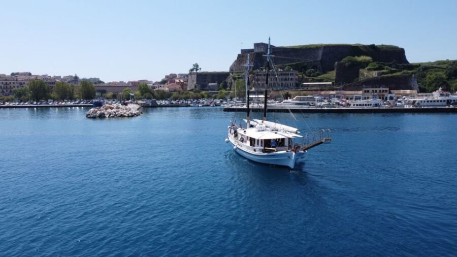 Corfu Town: Full-Day Cruise with Lunch, Drinks & Swim Stops - Secret coves and the third swim: time to snorkel and just relax