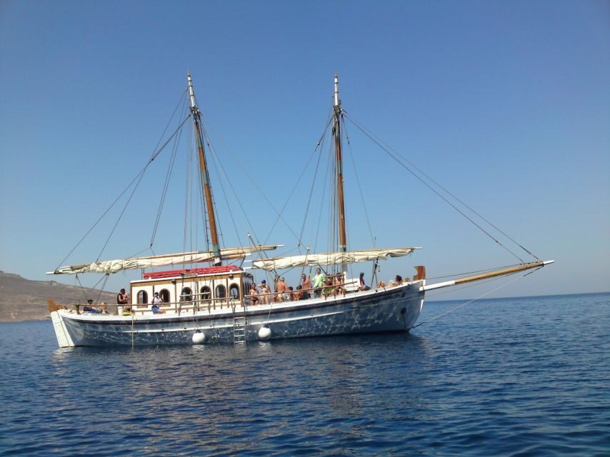 Corfu Town: Full-Day Cruise with Lunch, Drinks & Swim Stops - Getting started: Corfu Old Port and the wooden boat Koryfo