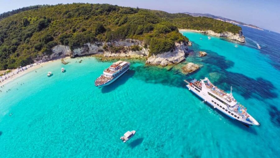 From Corfu Island: Antipaxos & Paxos Blue Caves Boat Cruise - Entering Paxos Blue Caves: White Cliffs, Photo Stops, and Cave Light