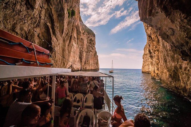 Full-Day Boat Tour of Paxos Antipaxos Blue Caves from Corfu - On-board vibe: seats, shade, AC, and the music on the return