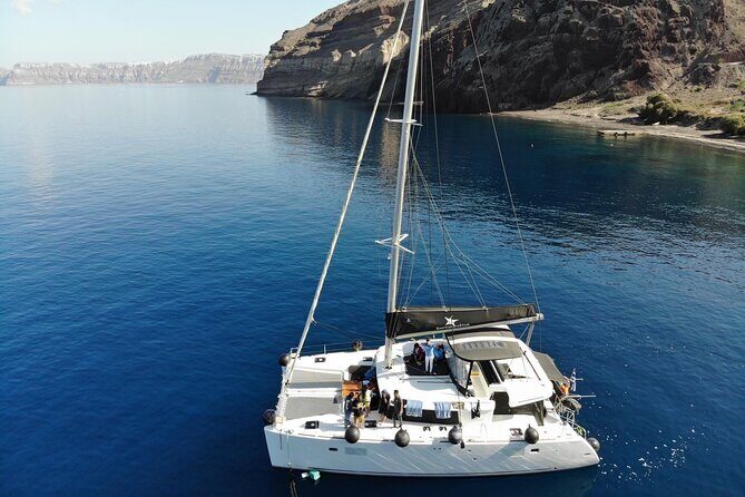 Half-Day Exclusive Catamaran Cruise in Santorini with Meal and Open Bar - Sailing past White Beach, Mesa Pigadia, and the Venetian Lighthouse