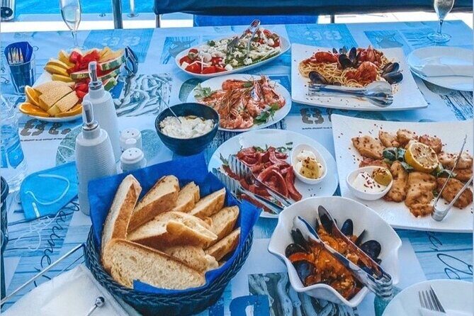 Half-Day Exclusive Catamaran Cruise in Santorini with Meal and Open Bar - Who should book this cruise, and who might want to pass