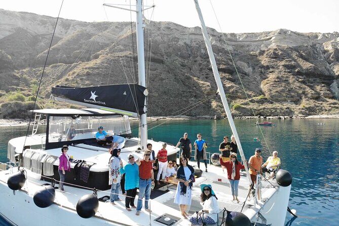 Half-Day Exclusive Catamaran Cruise in Santorini with Meal and Open Bar - Santorini volcano and hot springs: your warm-water reality check