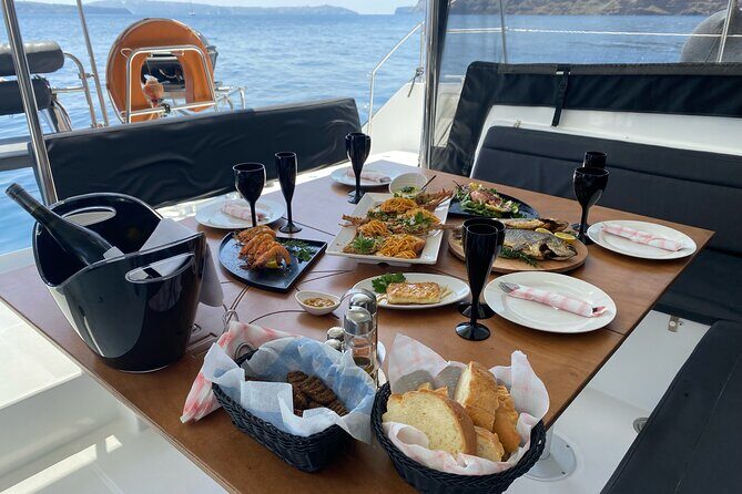 Half Day Premium Catamaran Cruise in Santorini including Oia - Volcano hot springs: warm water, short stay, big payoff
