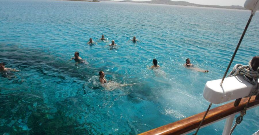 Mykonos: Sunset Party Boat Cruise with 1 Drink - Cruising the north coast on a traditional wooden boat