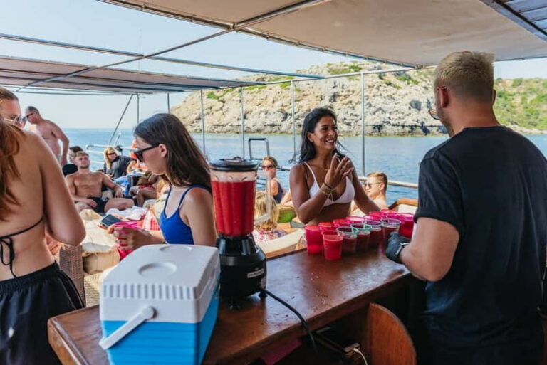 Rhodes: Anthony Quinn, Ladiko and Caves All-Inclusive Cruise - Aphrodite catamaran comfort: sofas, shade, and a crew that keeps things moving