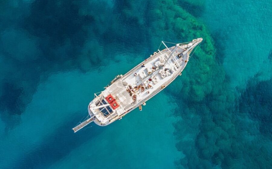 Rhodes: Boat Tour with Snorkeling, Gourmet Buffet & Open Bar - The coastline cruise before your first swim: Mandraki to Kalithea Bay