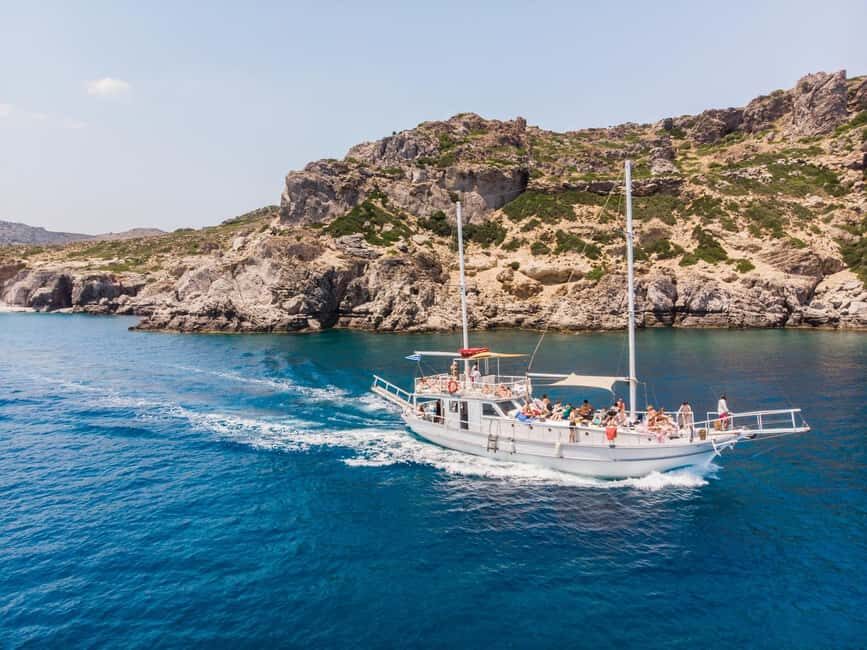 Rhodes: Boat Tour with Snorkeling, Gourmet Buffet & Open Bar - Snacks, wine, and sail time toward Faliraki and Afandou