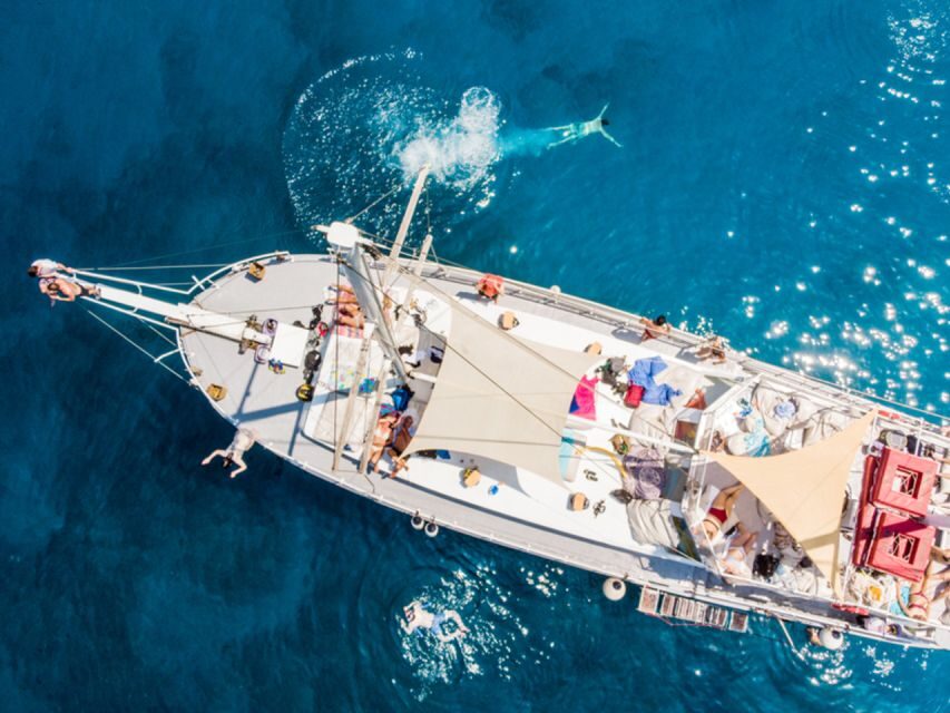 Rhodes: Boat Tour with Snorkeling, Gourmet Buffet & Open Bar - Snorkeling gear and the anchor-to-shore reality