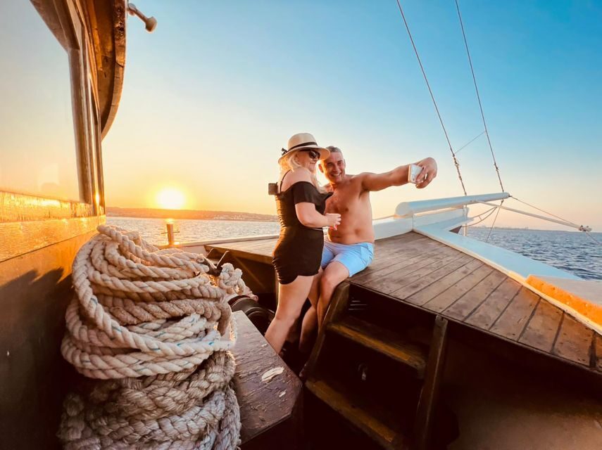 Rhodes: Sunset Cruise with Greek BBQ and Unlimited Drinks - Getting on board the Aphrodite Duchess at Mandraki Harbour