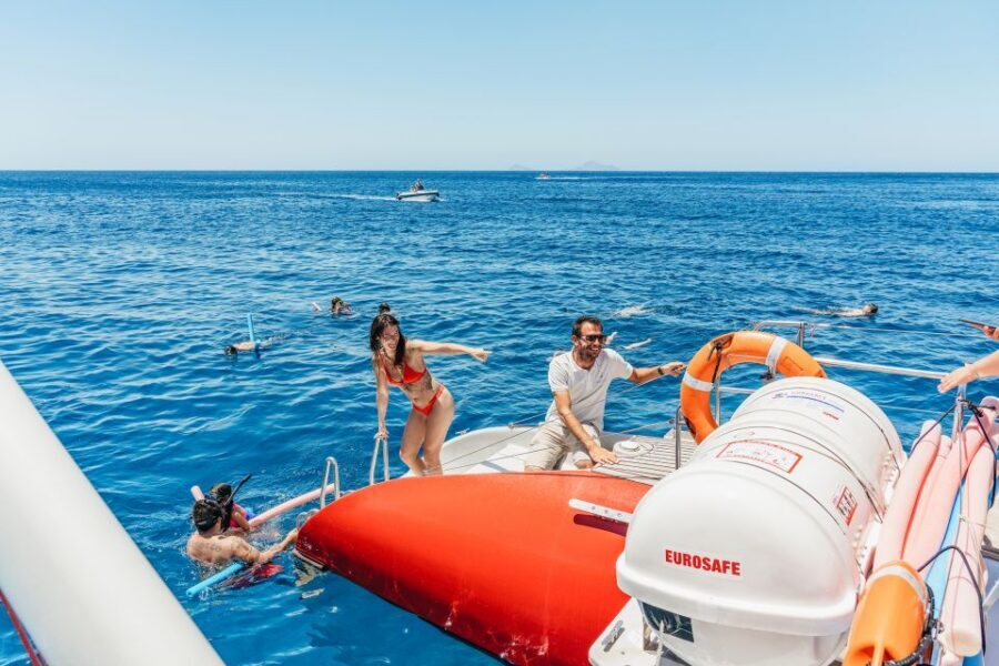 Santorini: Catamaran Tour with BBQ Dinner, Drinks, and Music - Ocean Voyager or Tahiti: what the 5-hour catamaran feels like