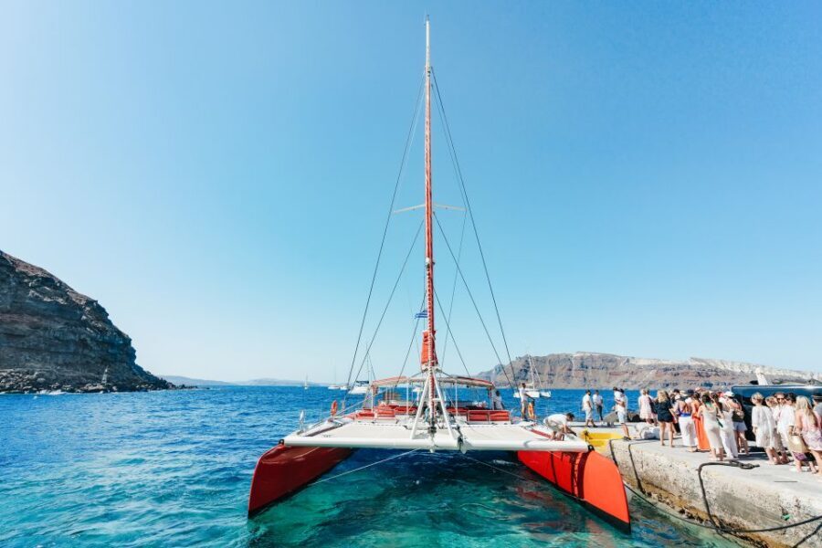 Santorini: Catamaran Tour with BBQ Dinner, Drinks, and Music - Hot Springs dip: starting with sulfur water and views