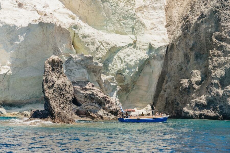 Santorini: Catamaran Tour with BBQ Dinner, Drinks, and Music - Sail back through the caldera: sunset option and weather reality