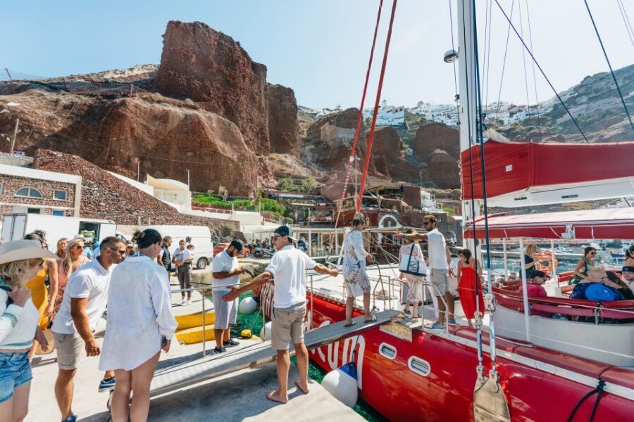Santorini: Catamaran Tour with BBQ Dinner, Drinks, and Music - What to bring: towels, sunscreen, and sea-motion support