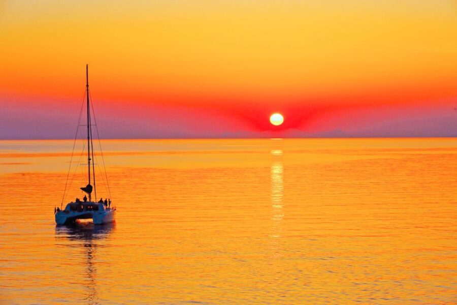 Santorini: Catamaran Tour with BBQ Meal and Unlimited Drinks - Red Beach Snorkeling: When the Cliffs Turn Underwater