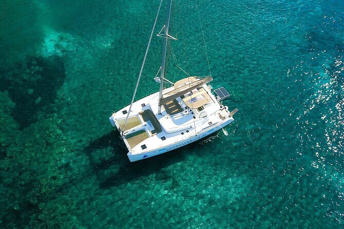 Santorini Classic Catamaran Cruise with BBQ, Drinks and Transfers - Volcano islets and caldera scenery: the science part you’ll actually remember