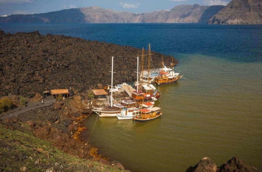 Santorini: Thirassia Islands and Volcano Guided Cruise - On the water near Oia: cliff views without the cliff crowds