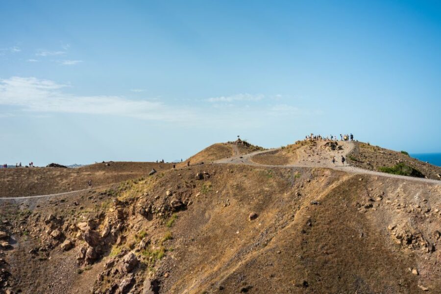 Santorini: Volcanic Islands Cruise with Hot Springs Visit - Palea Kameni hot springs: warm water, sulfur stains, and slippery edges